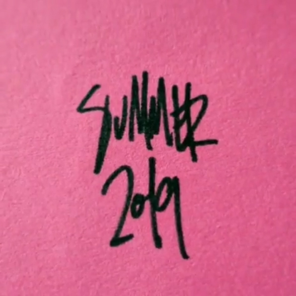 A pink piece of paper with the words "Summer 2019" written on it.